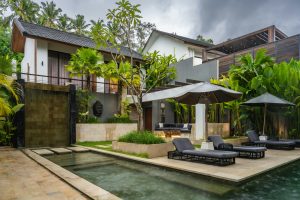 A backyard patio and pool using hardscaping materials